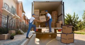 Two Safeway Moving movers loading a box into a moving truck